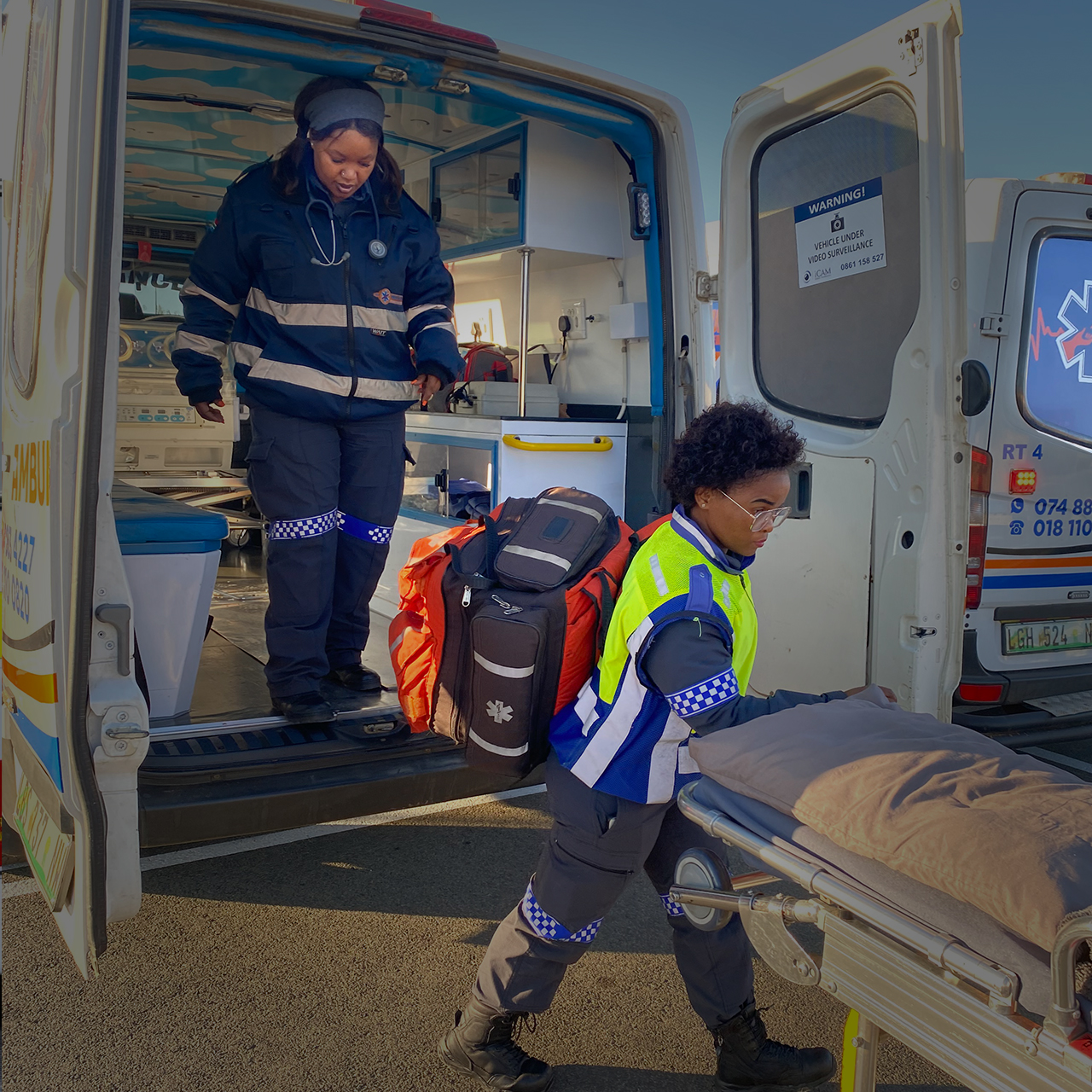 Paramedics loading a patient